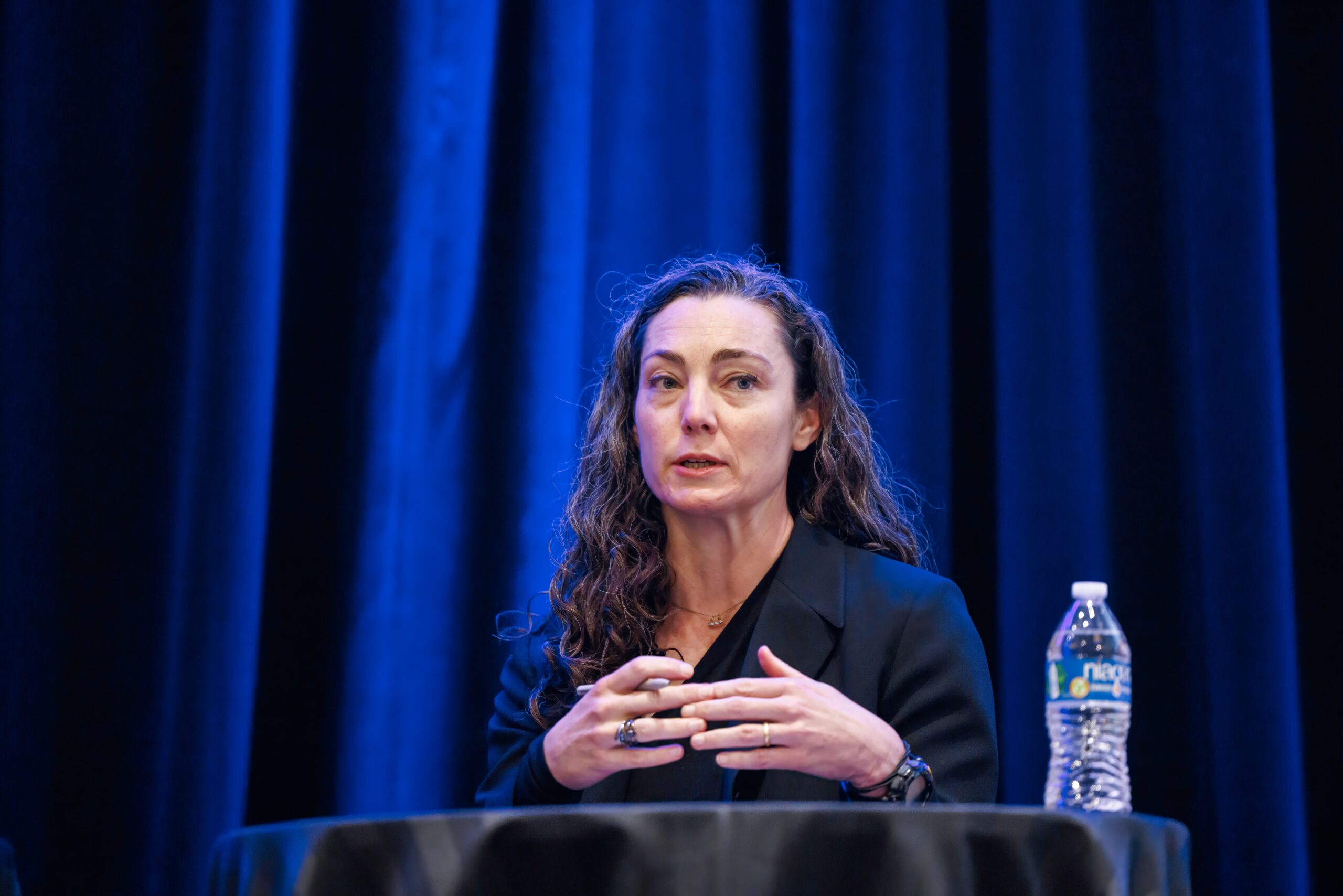 Emily Harding speaks at POC's 2025 Digital Transformation Summit