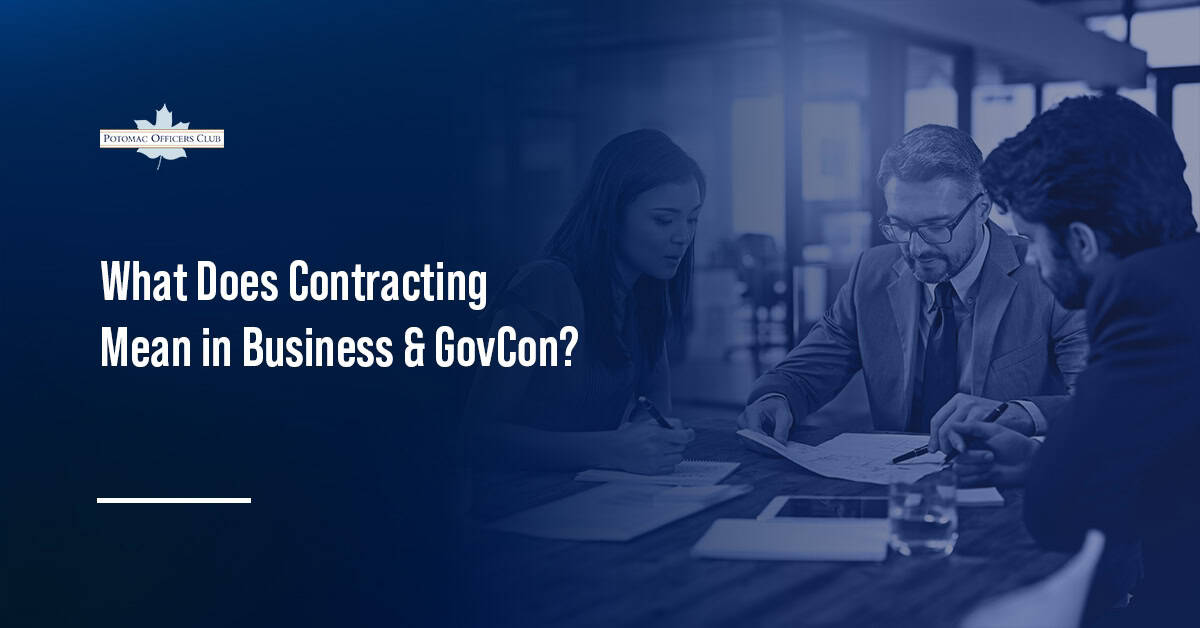 Professionals reviewing and signing a business contract.