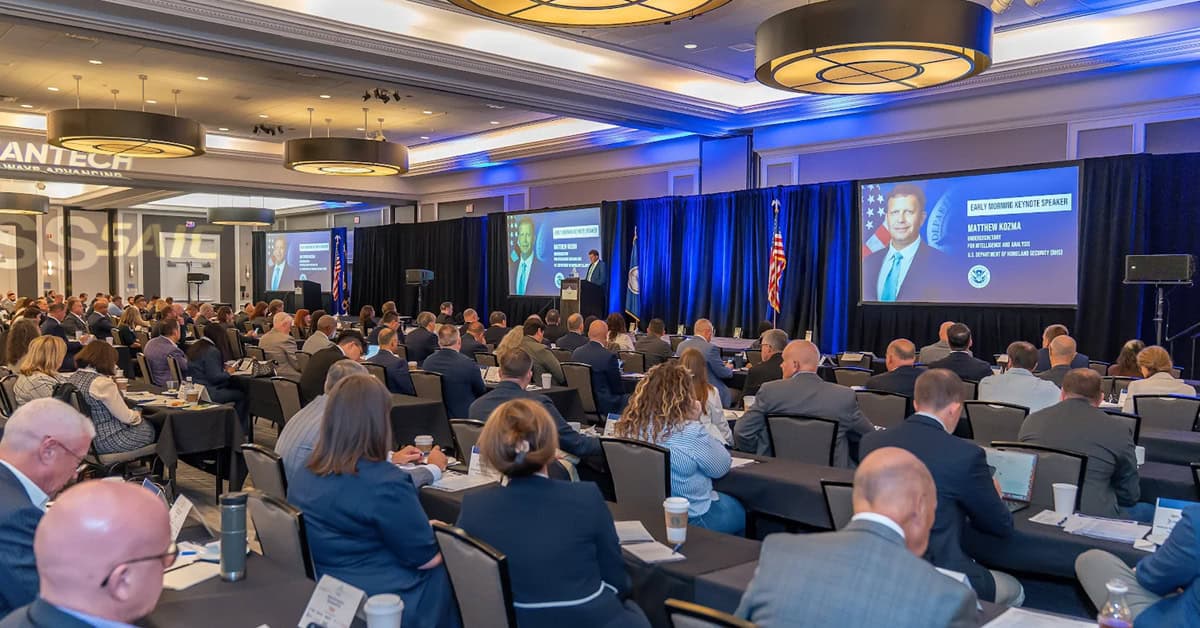 full-room-govcon-conference-potomac-officers-club Full room of POC conference. The Potomac Officers Club hosts monthly summits that draw large crowds of government contractors.